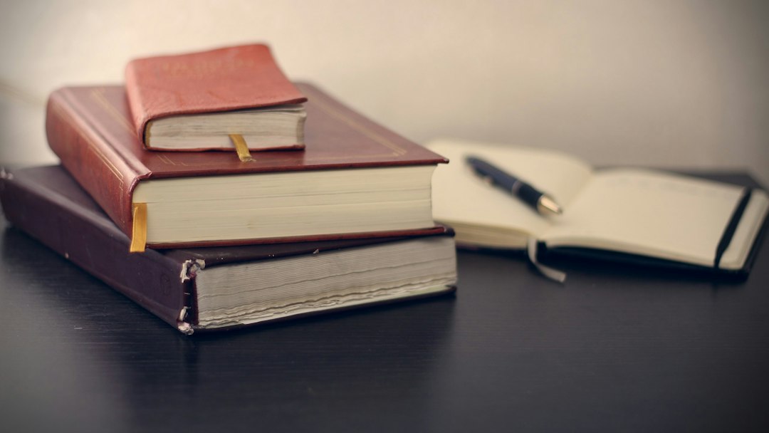 Stacked books and journal